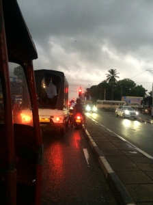 View from a tuktuk in Sri Lanka. tons of traffic and horns, but nothing stops moving, very fluid. 